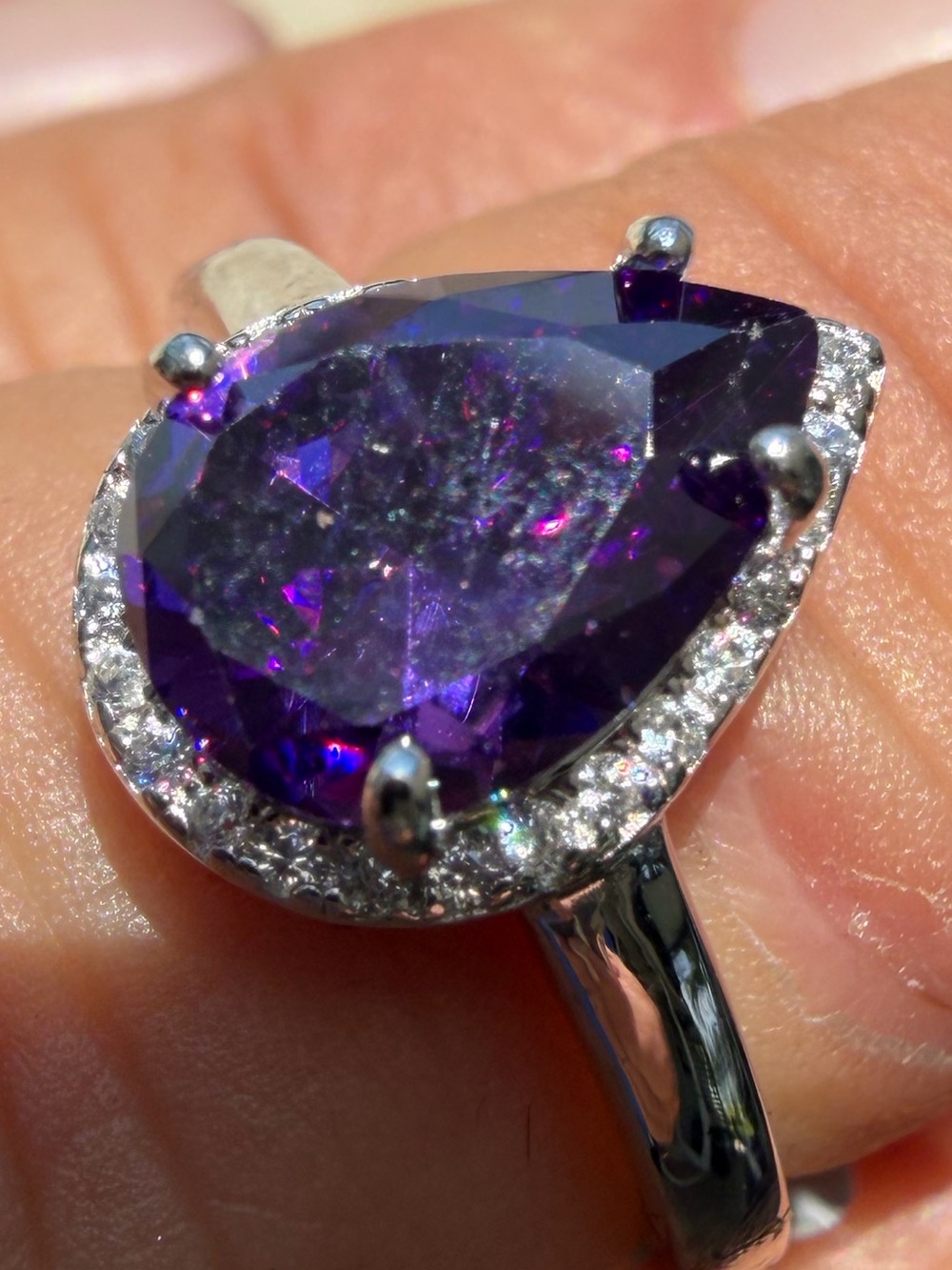 Elegant Pear-Cut Purple Amethyst Gem Halo Ring with White Sapphires